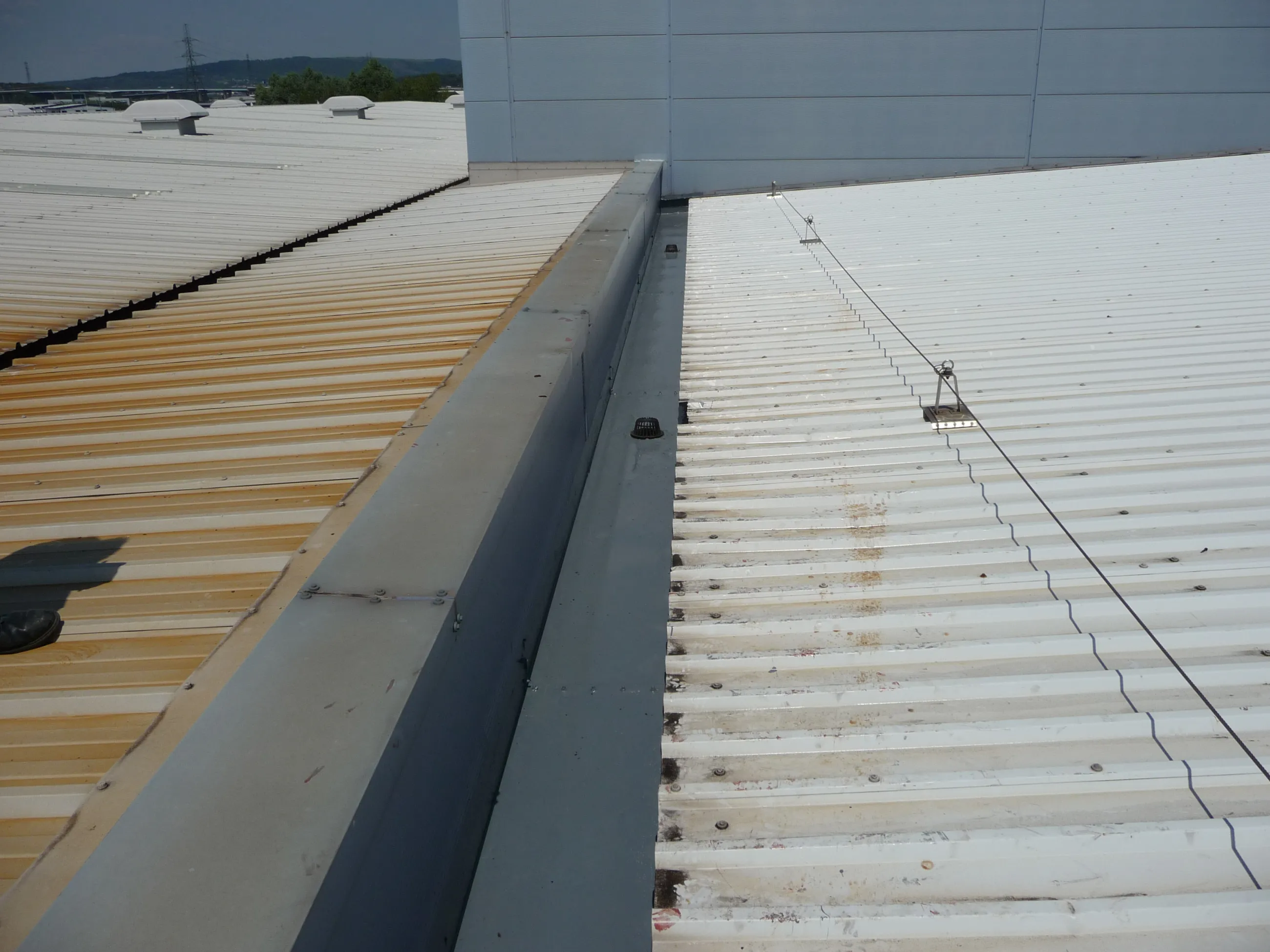 Top coat applied, rendering the factory roof watertight and weatherproof